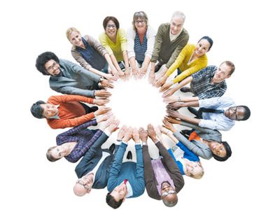 Individuals of different ethnicities bring their hands together to form a circle