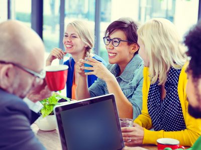 Group of people in business meeting sitting around table